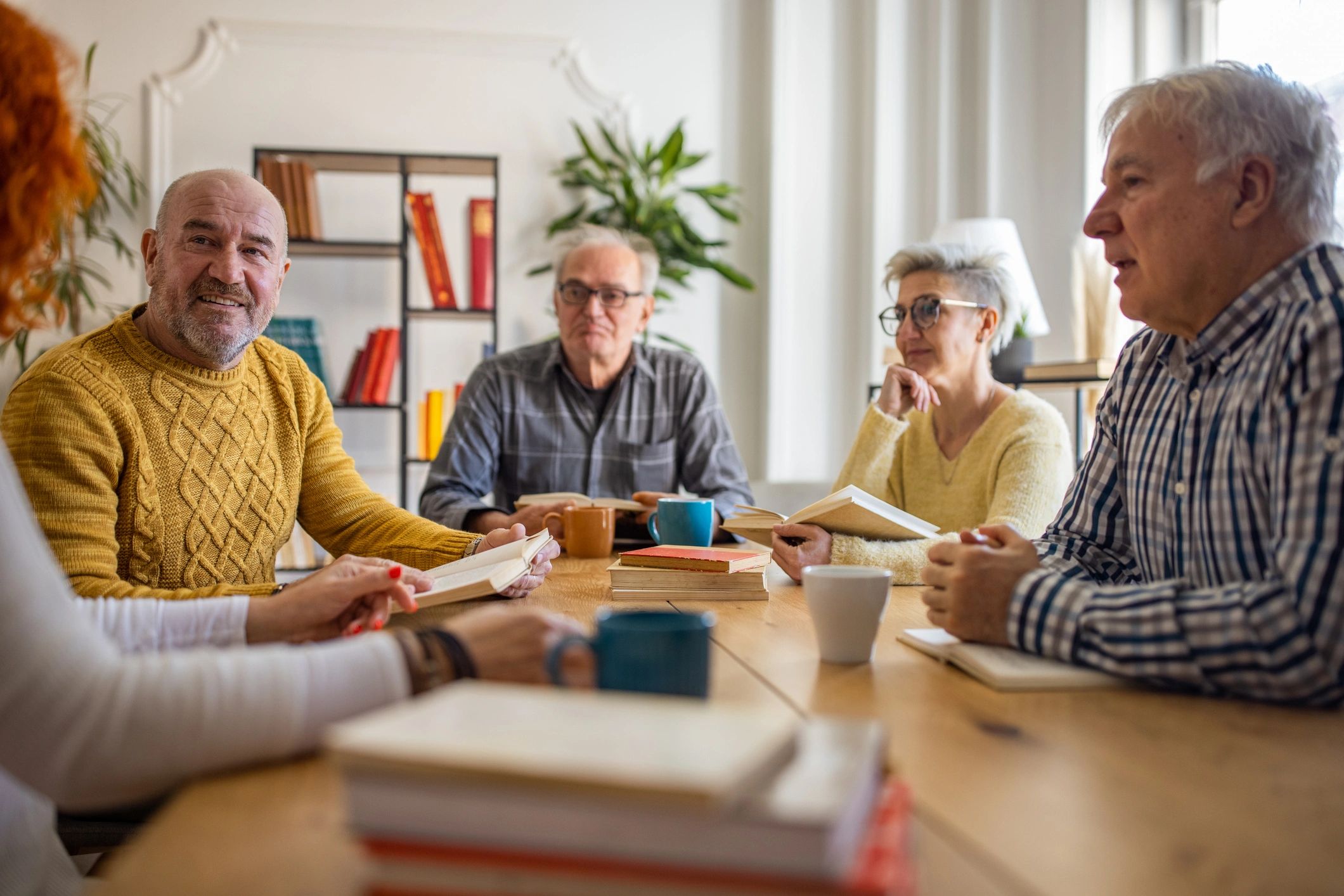 Residents participating in a book club discussion