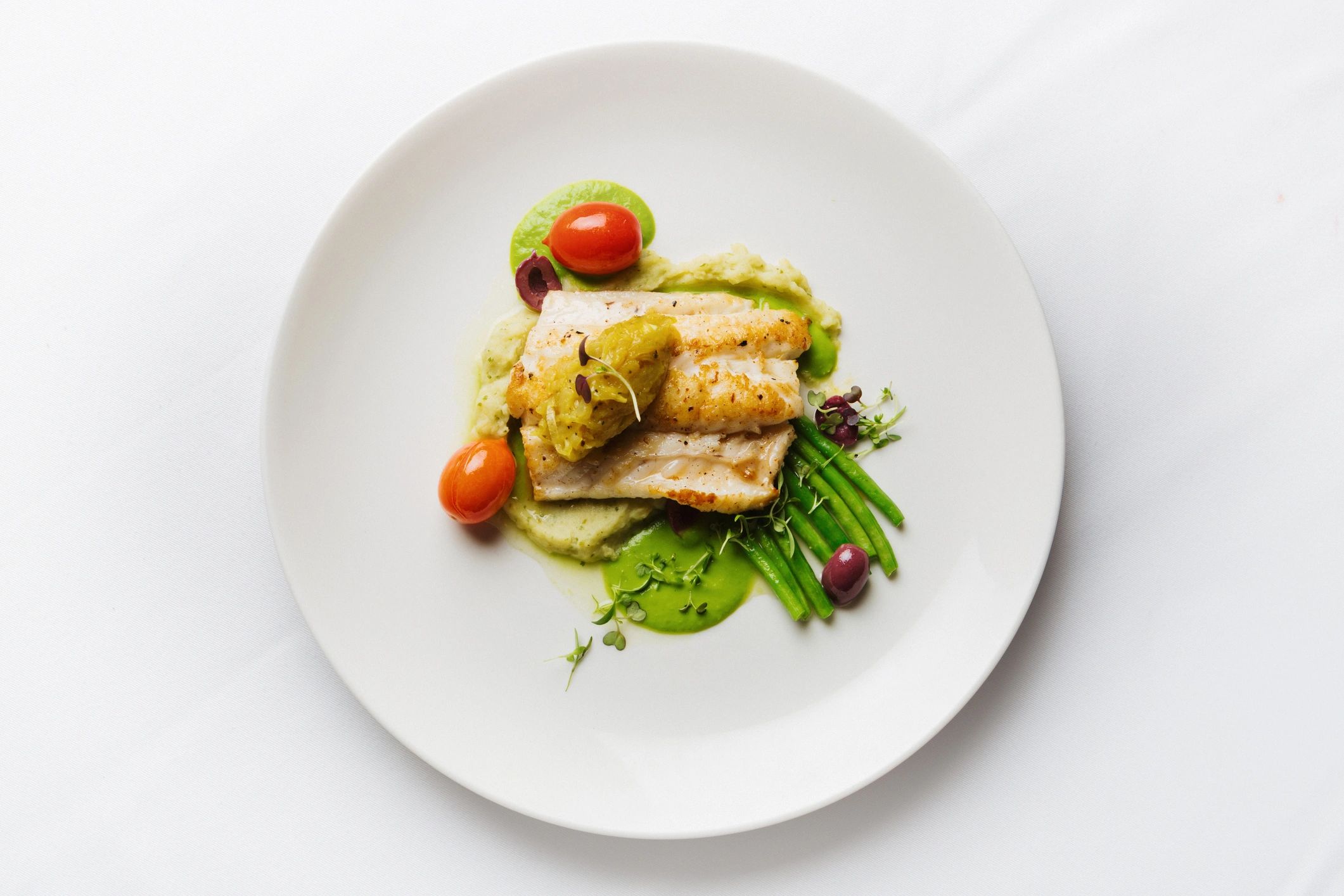 Healthy plated meal with grilled fish and vegetables