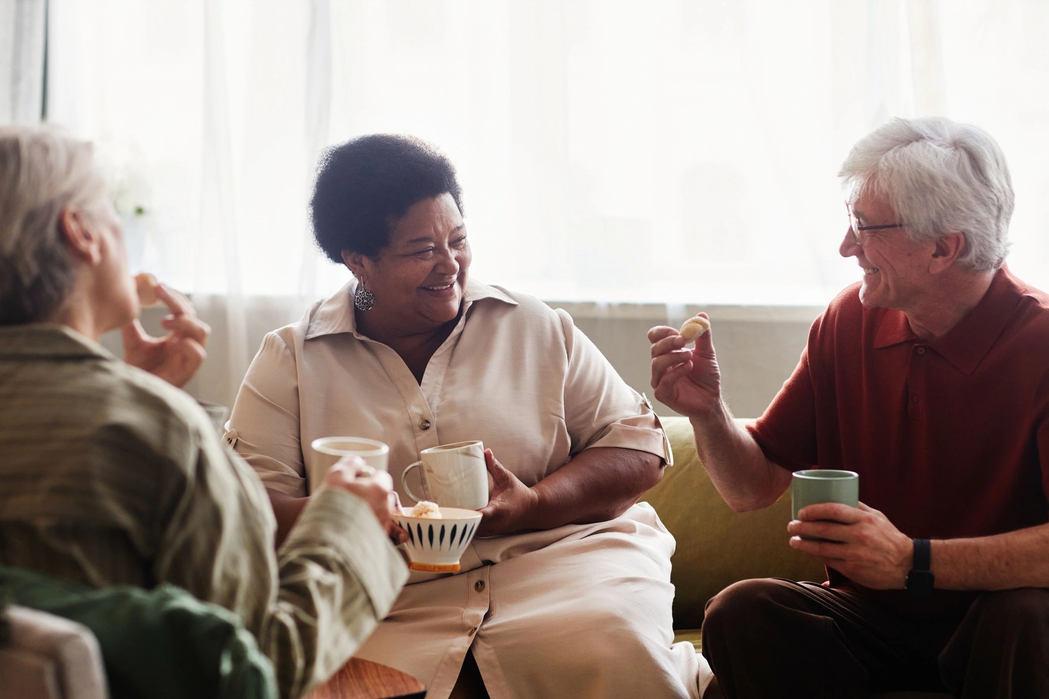 Residents enjoying tea time together in a comfortable lounge