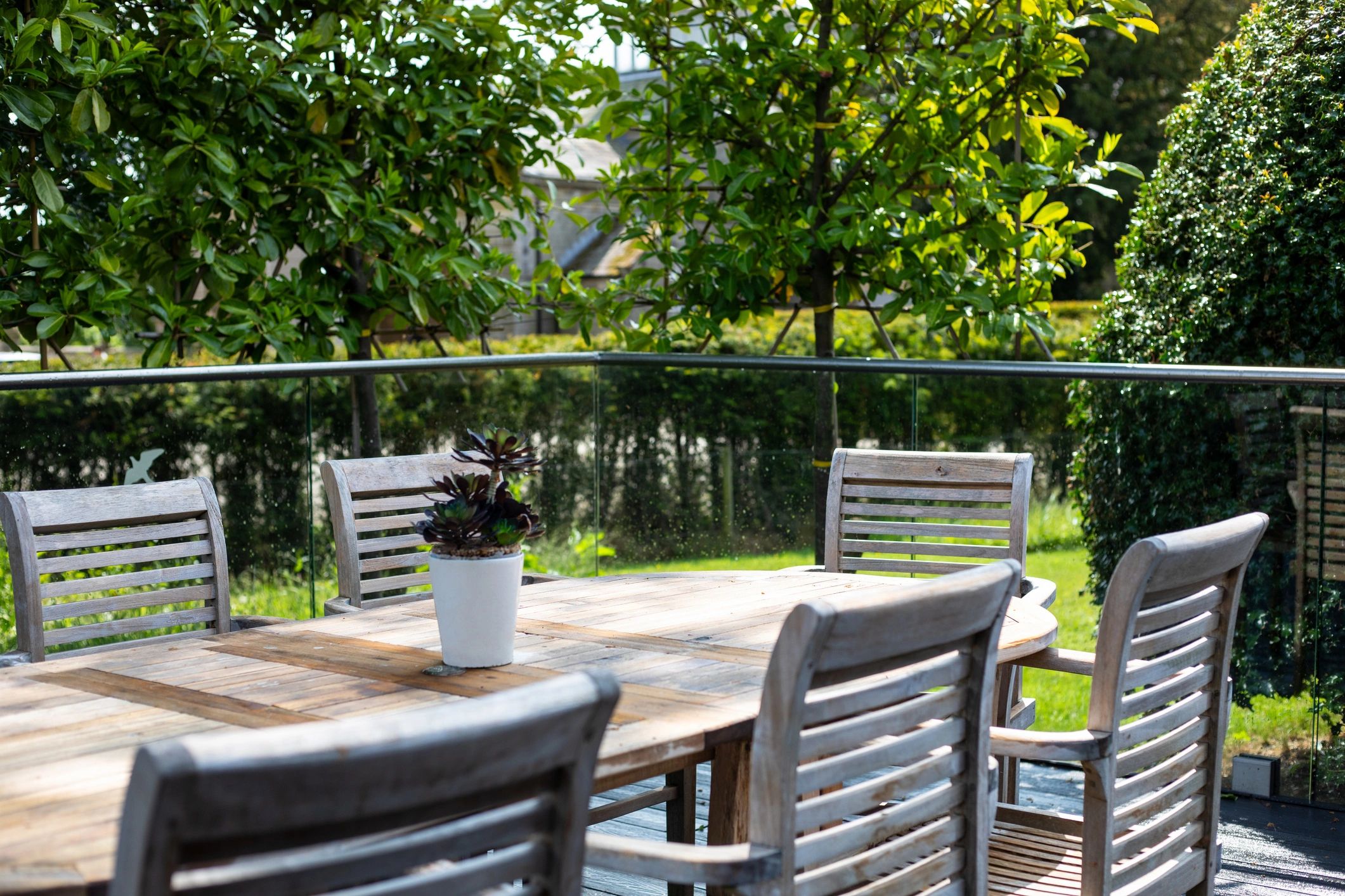 Peaceful garden seating area with tables and chairs