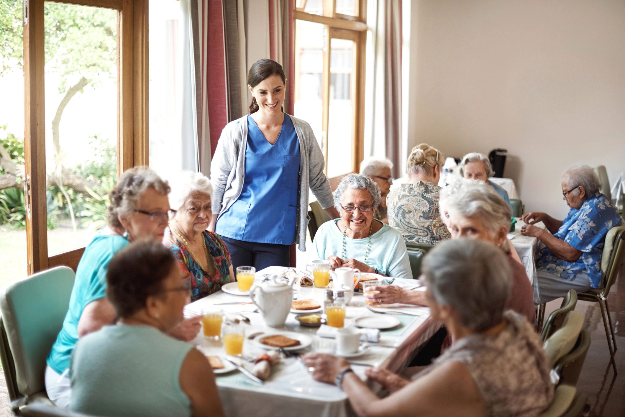 Group of seniors enjoying breakfast together